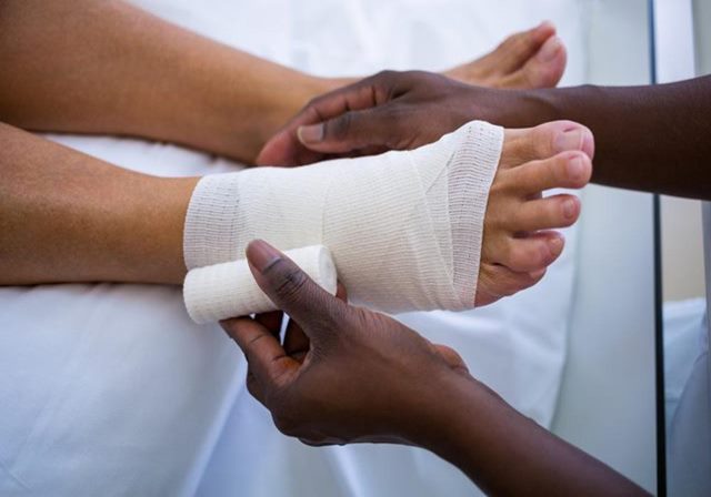 Foot wrapped with a bandage for pressure ulcer treatment